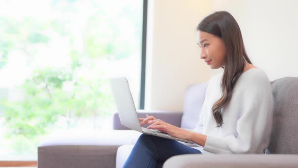 Young asian woman use laptop