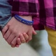 Children Hold Hands Child with Autistic Bracelet - VideoHive Item for Sale