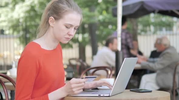 Online Shopping Failure for Young Woman Sitting on Bench