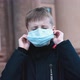 Child Boy Takes Off His Medical Mask Outdoors - VideoHive Item for Sale