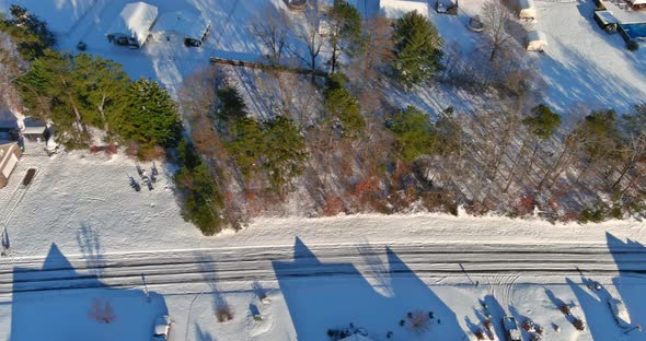 Aerial Top View of Snow Covered House Parked Cars Trees in Frosty Winter Weather Time