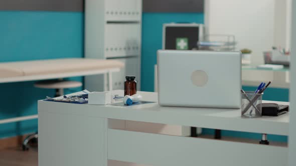 No People in Medical Cabinet with Empty Desk and Instruments