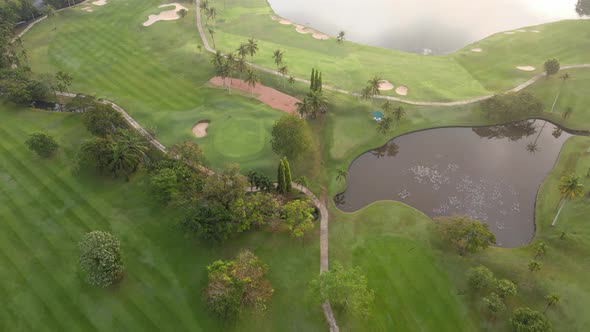 4K Aerial view Top-down view of Lawn Golf course in the morning or evening light, beautiful green