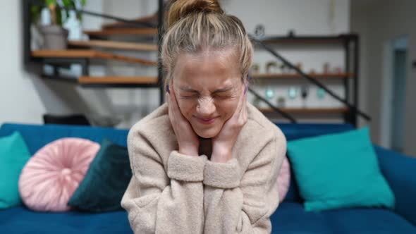 Front View Nervous Teenage Girl Covering Ears with Hands with Dissatisfied Facial Expression