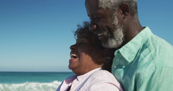 Senior couple hugging at the beach