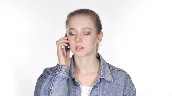 Casual Young Woman Talking on Smartphone with Customer