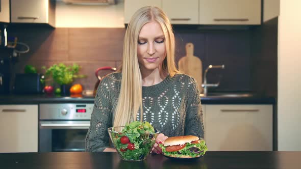 Girl Preferring Salad to Hamburger