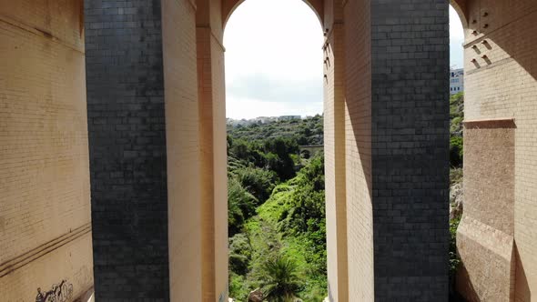 Drone flying under bridge in Malta Nature Valley