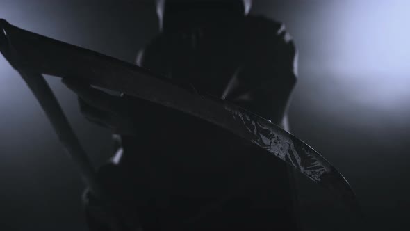 Horrible Dark Figure In A Hoodie With A Scythe