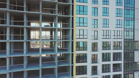 Aerial view of high residential apartment building under construction. Real estate development