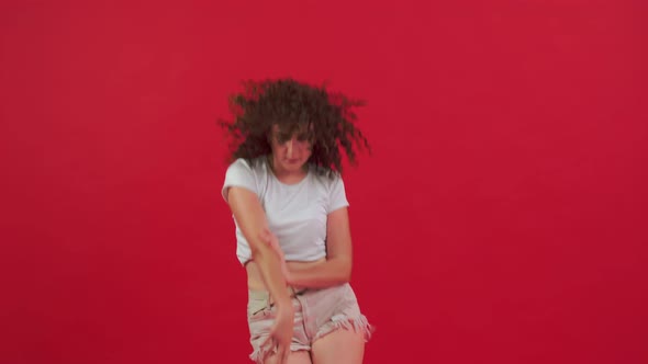 Woman Dancing on a Red Background
