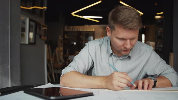 Young professional with tablet at work