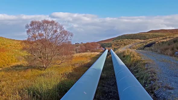 Pipeline of the Storr Lochs Hydroelectric Power Station Nestled Under the Mountains of the