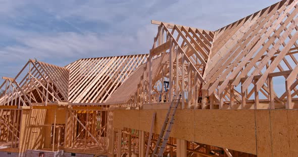 Wooden Beams at Construction the Roof Truss System House