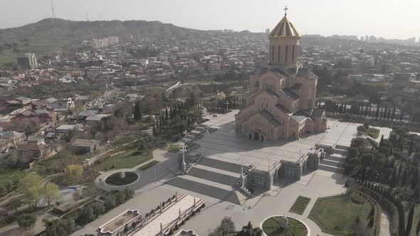 Aerial view of Holy Trinity Cathedral Sameba in Tbilisi Georgia. Sunrise drone footage 2021