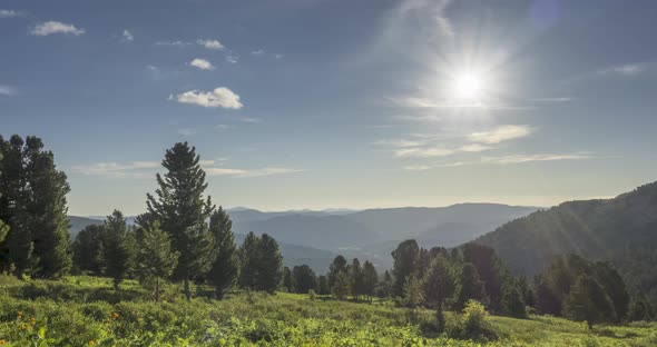 Mountain Meadow Timelapse, Wild Nature and Rural Field, Clouds, Trees, Green Grass and Sun Rays