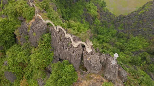 Aerial Shot of the Small Temple and a Dragon on the Top of Marble Mountain Mua Cave Mountain in Ninh