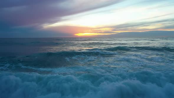 Sea Waves at a Bright Juicy Sunset Filmed Over a Drone