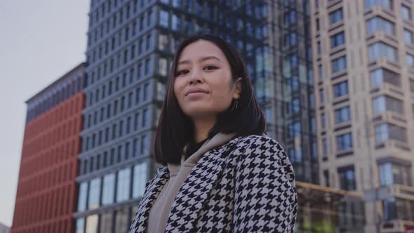 Lowangle Portrait of a Young Adult Asian Woman in Downtown District