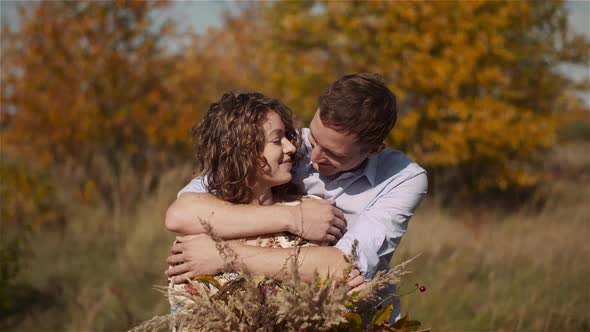 Happy Teenage Couple First Kiss Girl Kissing. Loving Couple Embracing.
