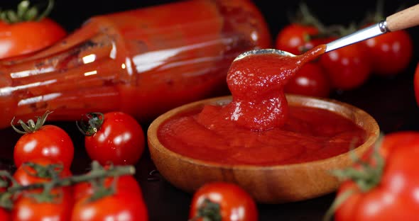 The Finished Tomato Sauce in a Bowl Mix with a Spoon. 