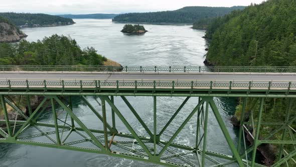 Side scrolling drone shot of Deception State Park's steel bridge.