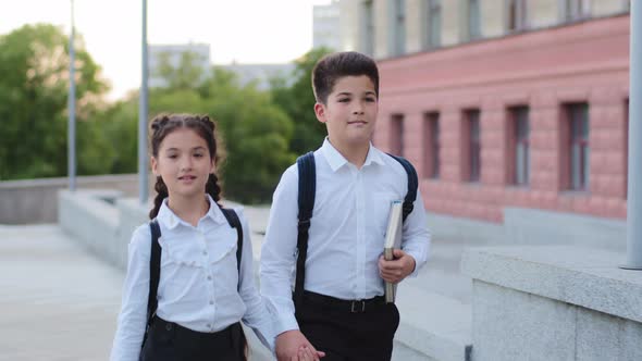 Two Children Schoolchildren Hispanic Pupils Kids Little Girl and Boy with Book Brother and Sister