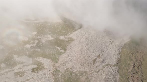 Scenic aerial view of moving white clouds at Abuli Mountain. Georgia