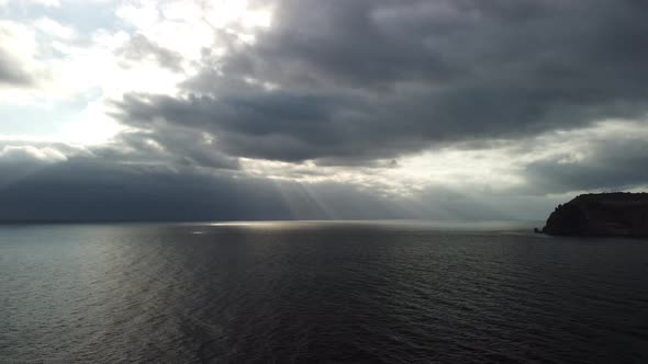 Aerial View From Above on Calm Azure Sea and Volcanic Rocky Shores