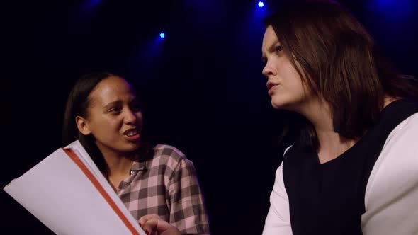 Teenagers rehearsing in a theatre