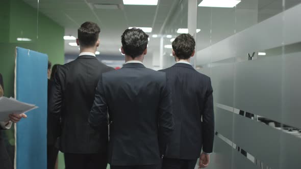 Rear view of businessmen walking