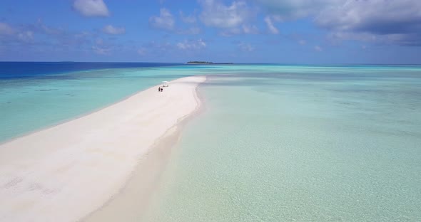 Wide angle birds eye abstract view of a paradise sunny white sand beach and blue sea background in h