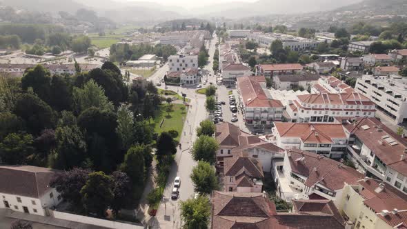 Small town of Arouca with mountain range in horizon, aerial drone view