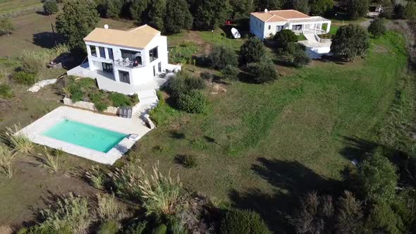 Daring aerial drone flight slowly sinking down drone shot of an luxury real estate villa on malibu c