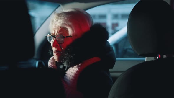 Elderly Couple Witnessing Crime Scene in Their Car