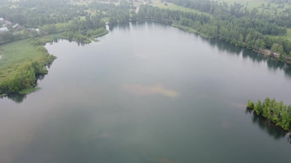 Drone Flying Right over Lake