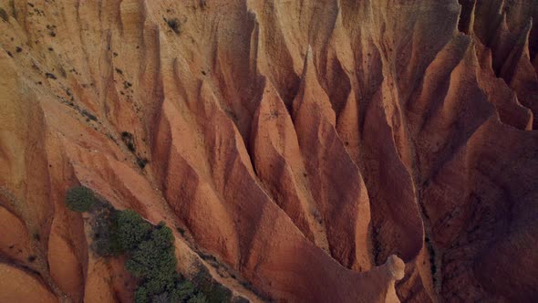 Drone top view of rare sandstone mountain formation in Spain,Europe during sunset time - Cárcavas,Ma