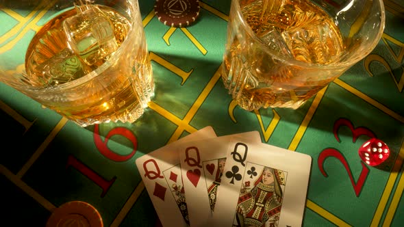 Top View of Gaming Table in a Casino with Glasses of Whiskey and Set of Three Ladies