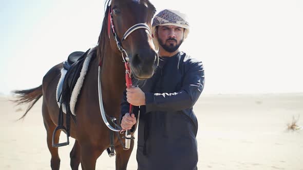 Arabian man with his horse