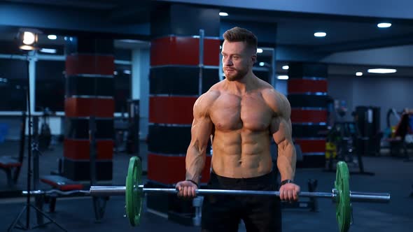 Young man doing fitness exercises. Fitness man doing exercises in the gym