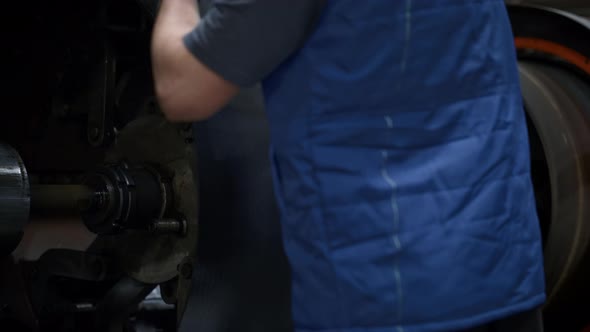 Tyre Manufacture Employee Hands Operating Rubber Tape on Technological Machine