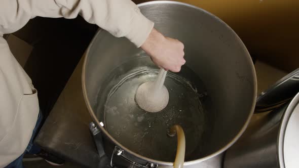 Slow motion footage of beer home brewing supplies and processes 