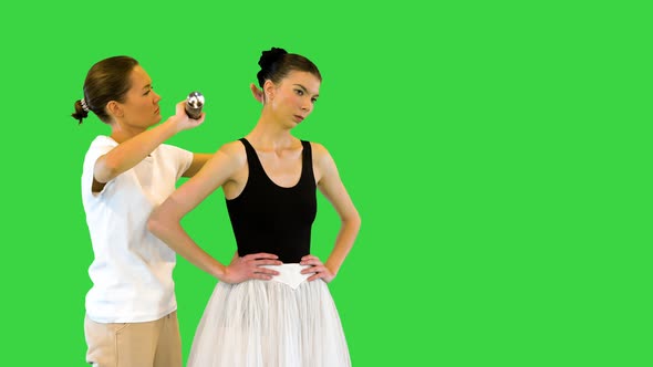 Stylist Makes a Hair Styling for Young Ballerina on a Green Screen Chroma Key