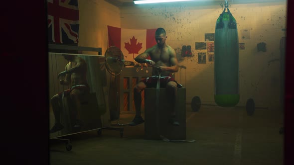 Boxer wrapping bandages on his hand