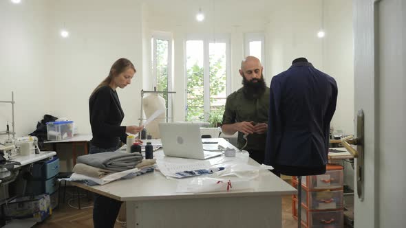 Man and woman in a tailor's shop