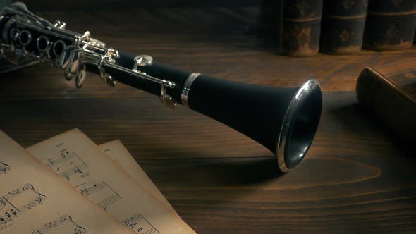 Clarinet On Table With Books