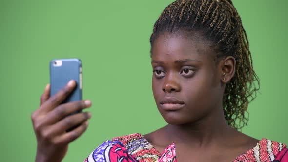 Young African Woman Using Phone