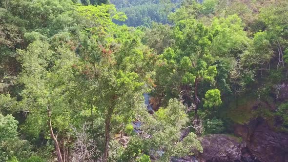 Drone Flies Above Waterfall Ta Gu Streaming Against Jungles