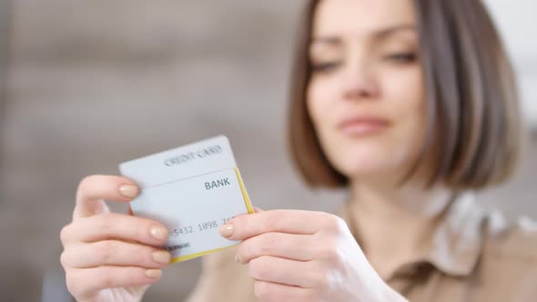 Woman Looking at Her Credit Cards