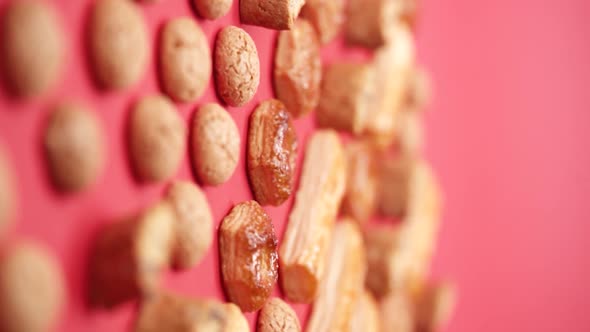 Vertical video, Close-up: puff pastry biscuits rotate on a stand in a glass cloche